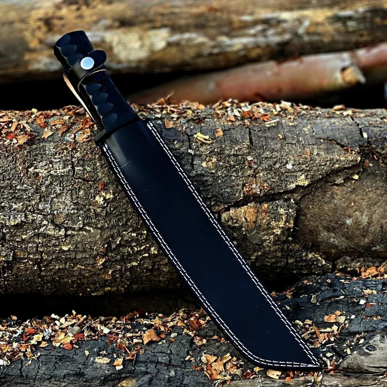Handmade Damascus kukri knife with black sheath, resting on rustic wood with wood shavings.