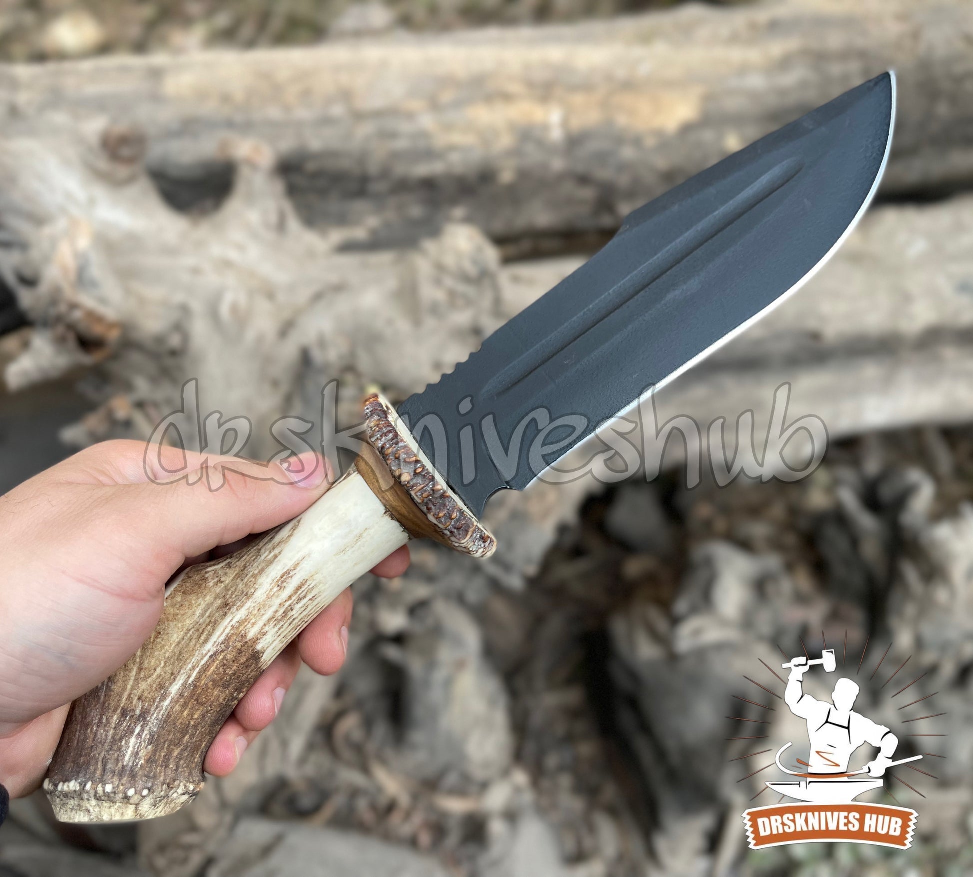 Hand holding a knife with a wooden handle against a natural background