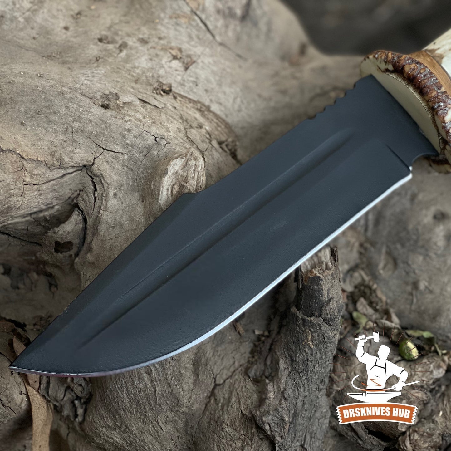 Knife blade on a wooden surface with 'BRS Knives Hub' logo.