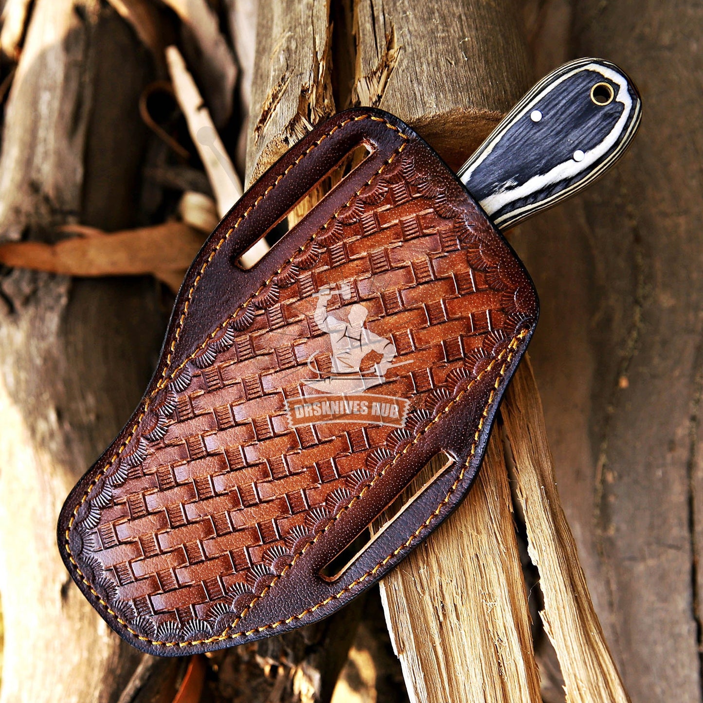 Brown leather knife sheath with woven pattern on a wooden background