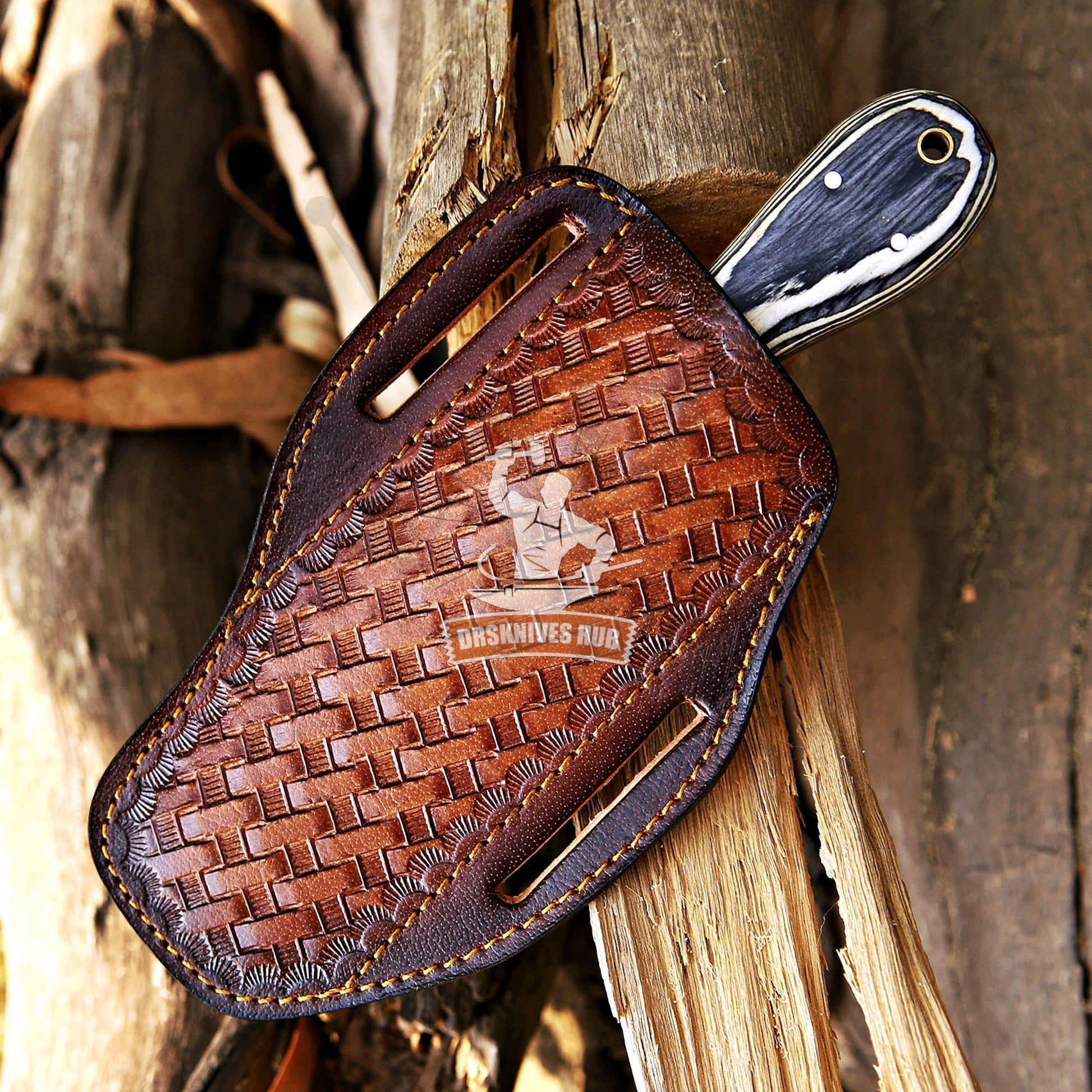 Brown leather knife sheath with woven pattern on a wooden background