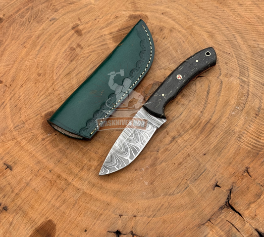 Knife with a green sheath on a wooden surface