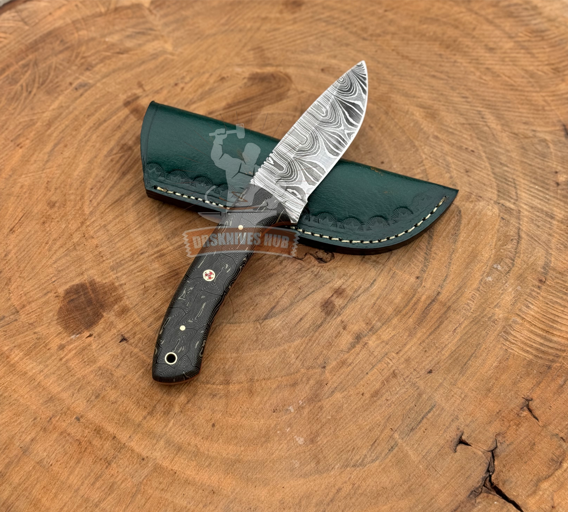 Knife with a green sheath on a wooden surface