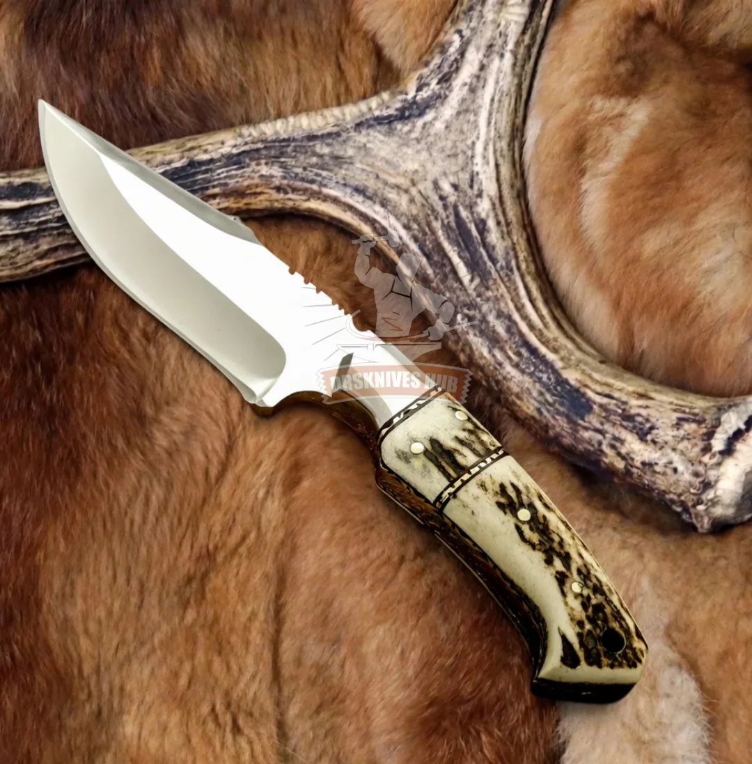 Handmade Damascus knife with exotic bone handle, resting on fur and antler