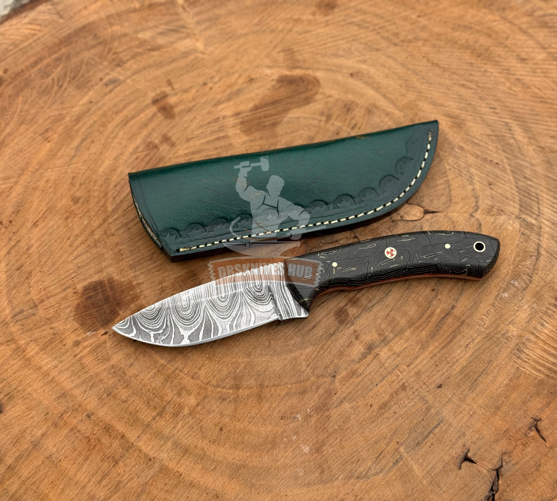 Knife with a sheath on a wooden surface